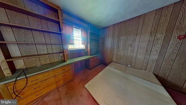 a view of an empty room and fire place