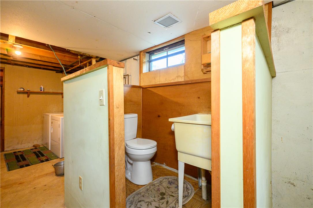 1644 9th Street Bethlehem, PA 18020 - Photo 19 of 27 Functional basement space includes laundry and a convenient half-bath setup.