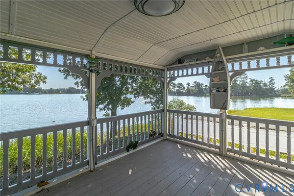 a view of a porch with wooden floor