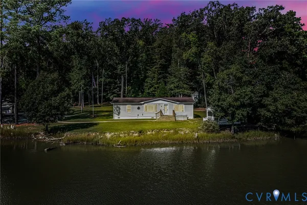a view of a lake with a yard