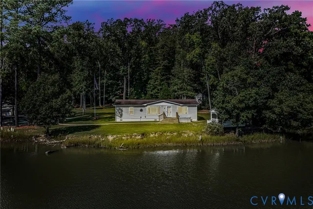 a view of a lake with a yard