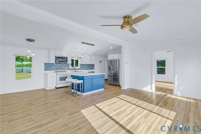 a kitchen with a cabinets and appliances