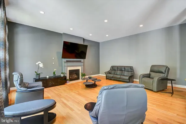 a bedroom with furniture and a flat screen tv