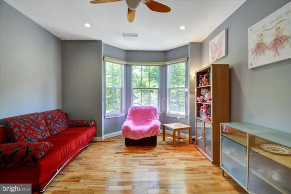 a bedroom with two beds and a chandelier