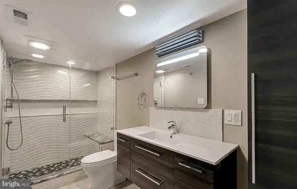 a living room with furniture a window and a flat screen tv