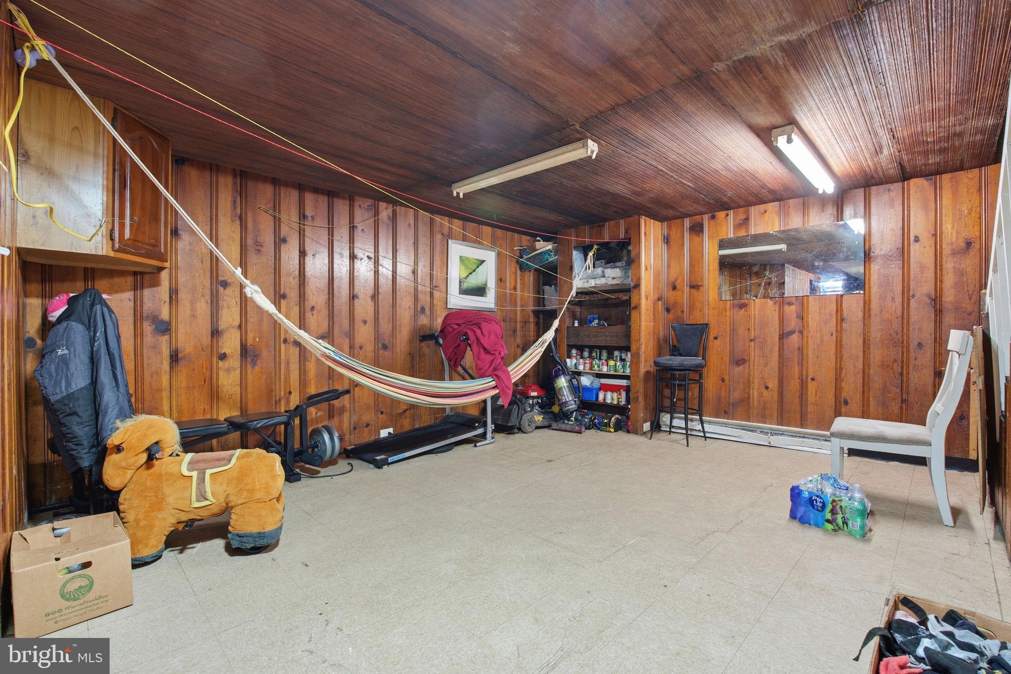 3928 8th Street Baltimore, MD 21225 - Photo 19 of 20 a room with lots of gym equipment