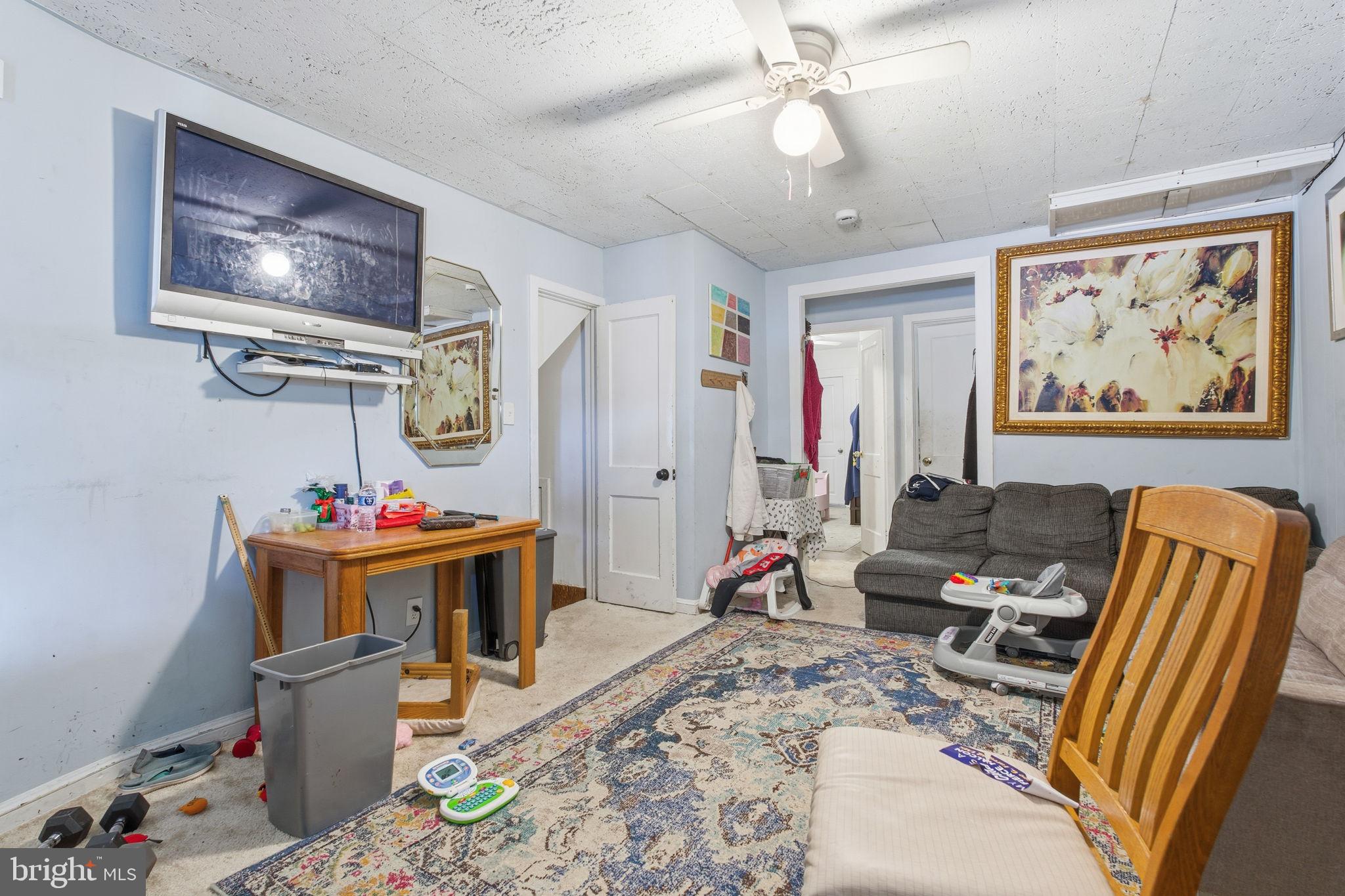 3928 8th Street Baltimore, MD 21225 - Photo 3 of 20 a view of a workspace with furniture and toys