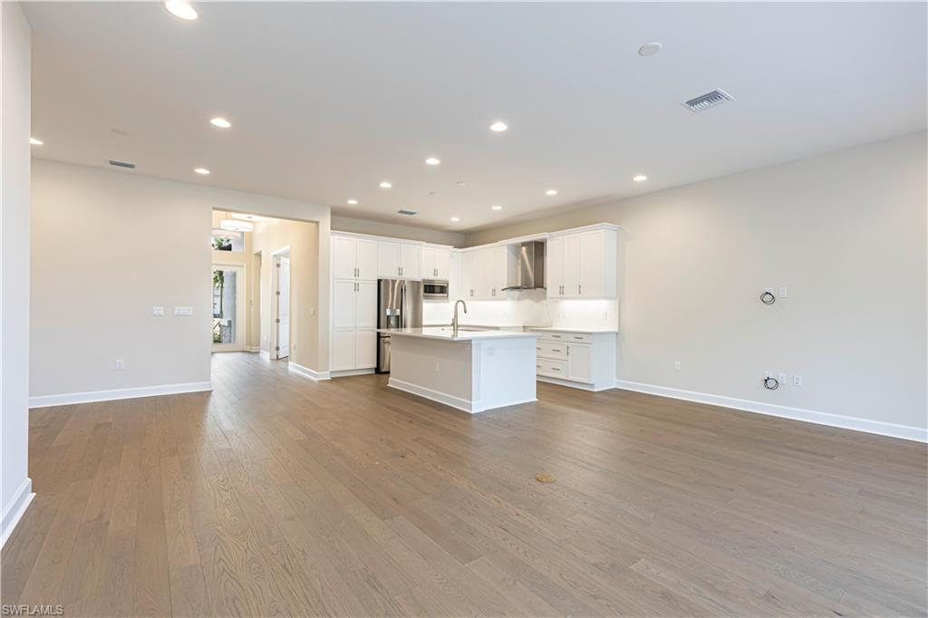2691 Ridgecrest Place Naples, FL 34112 - Photo 26 of 27 a view of kitchen with wooden floor
