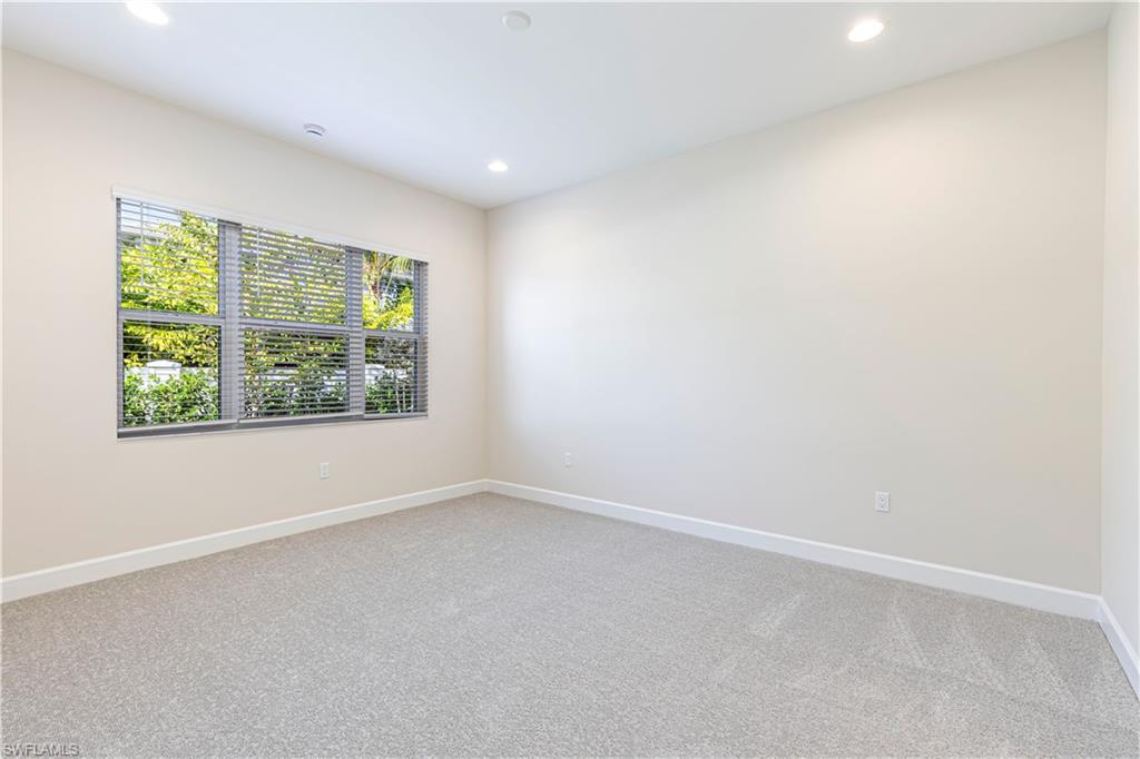 2691 Ridgecrest Place Naples, FL 34112 - Photo 13 of 27 an empty room with a window