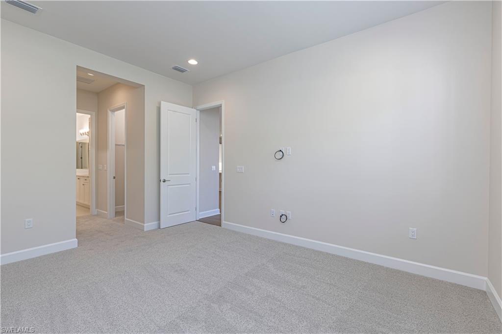 2691 Ridgecrest Place Naples, FL 34112 - Photo 14 of 27 a view of an empty room