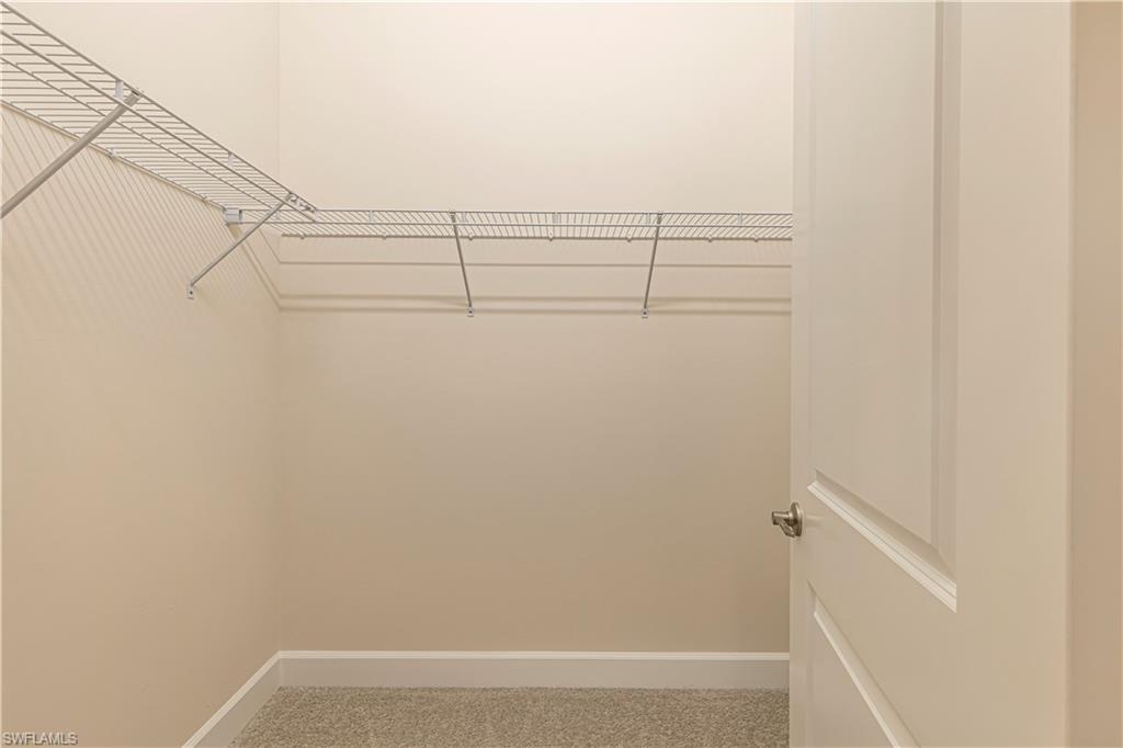 2691 Ridgecrest Place Naples, FL 34112 - Photo 16 of 27 a view of small space with racks on the wall