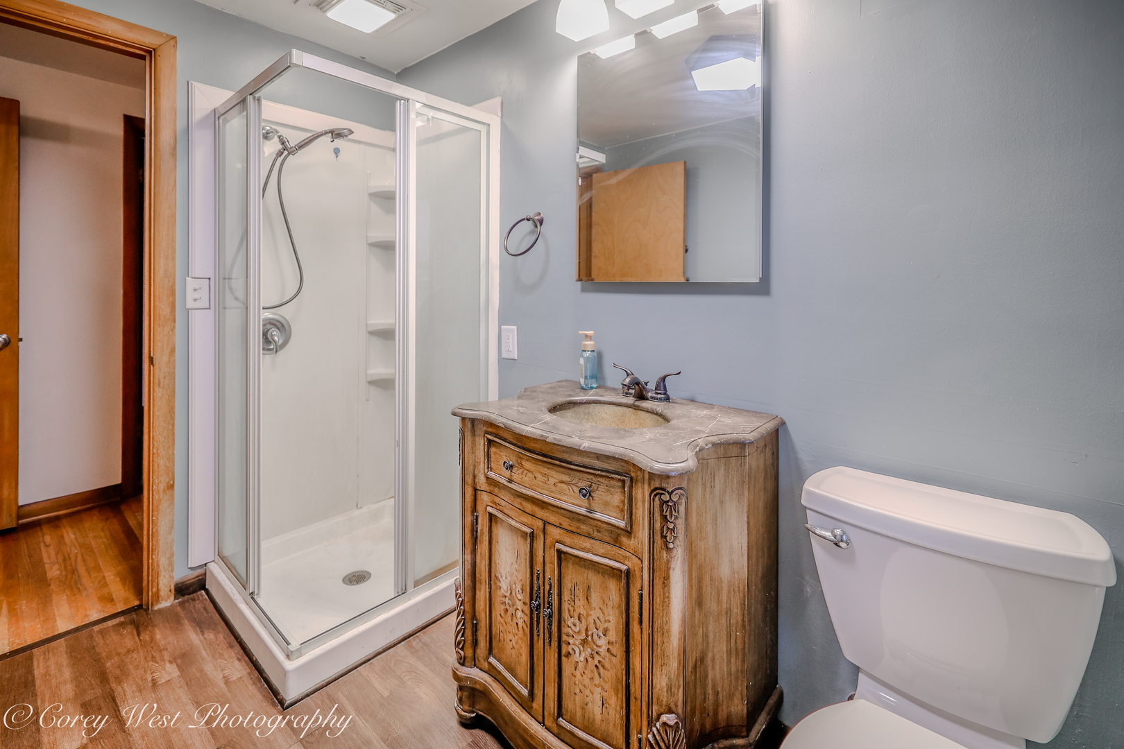 8994 Highway 64 Sycamore, IL 60178 - Photo 24 of 37 a bathroom with a granite countertop sink toilet and shower