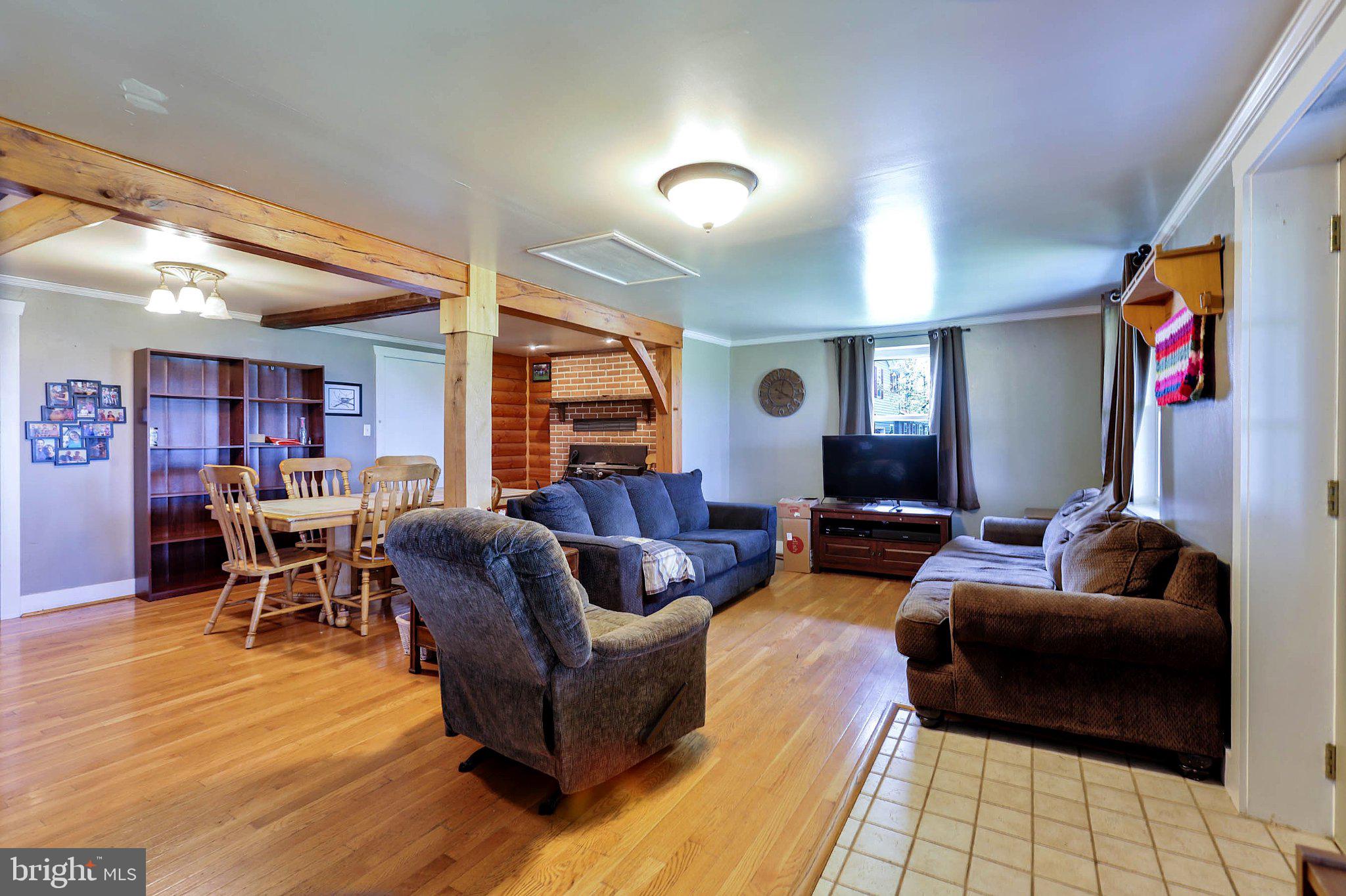 11661 Tanyard Hill Road Orrstown, PA 17244 - Photo 13 of 26 a living room with furniture and wooden floor