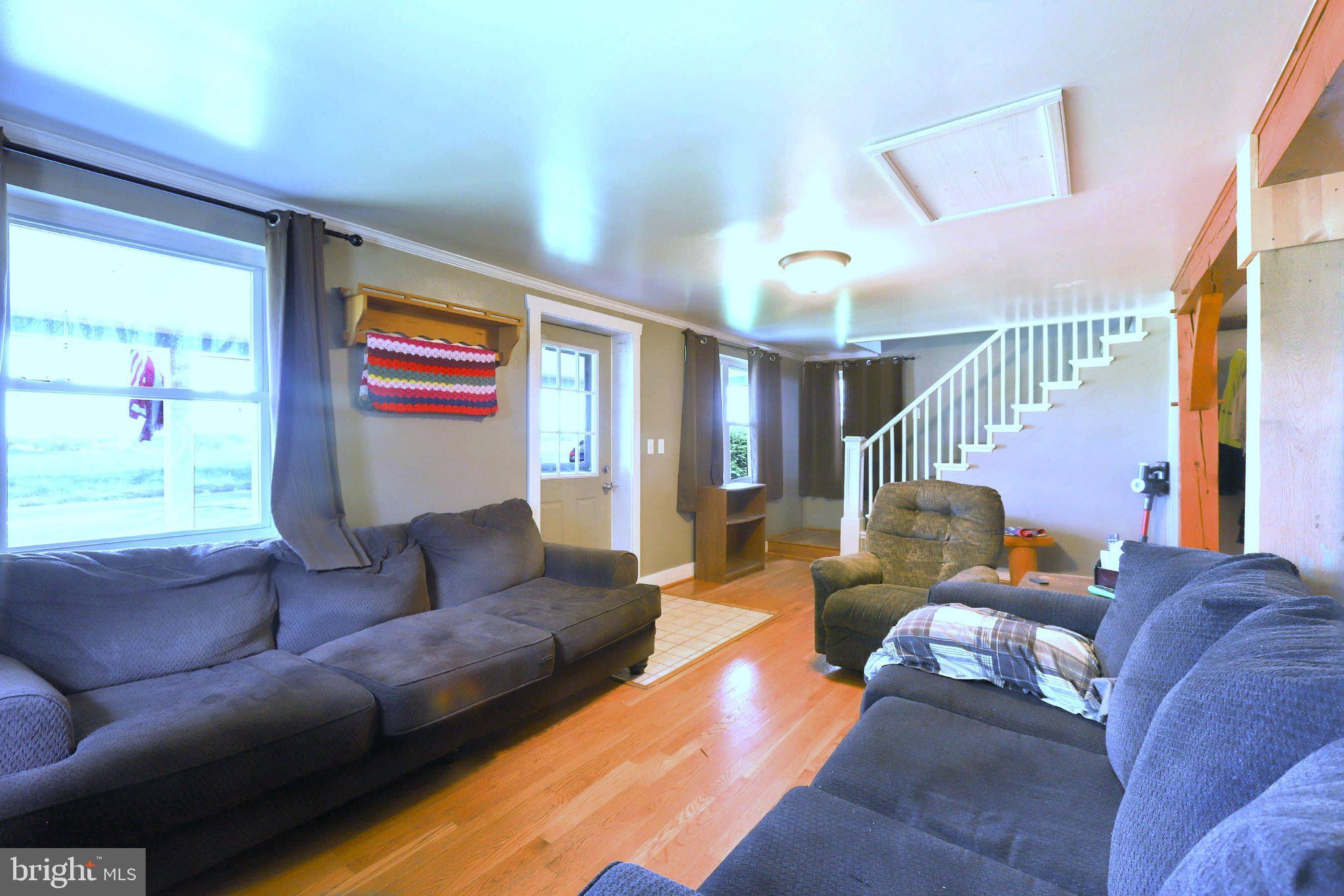 11661 Tanyard Hill Road Orrstown, PA 17244 - Photo 14 of 26 a living room with furniture and a large window