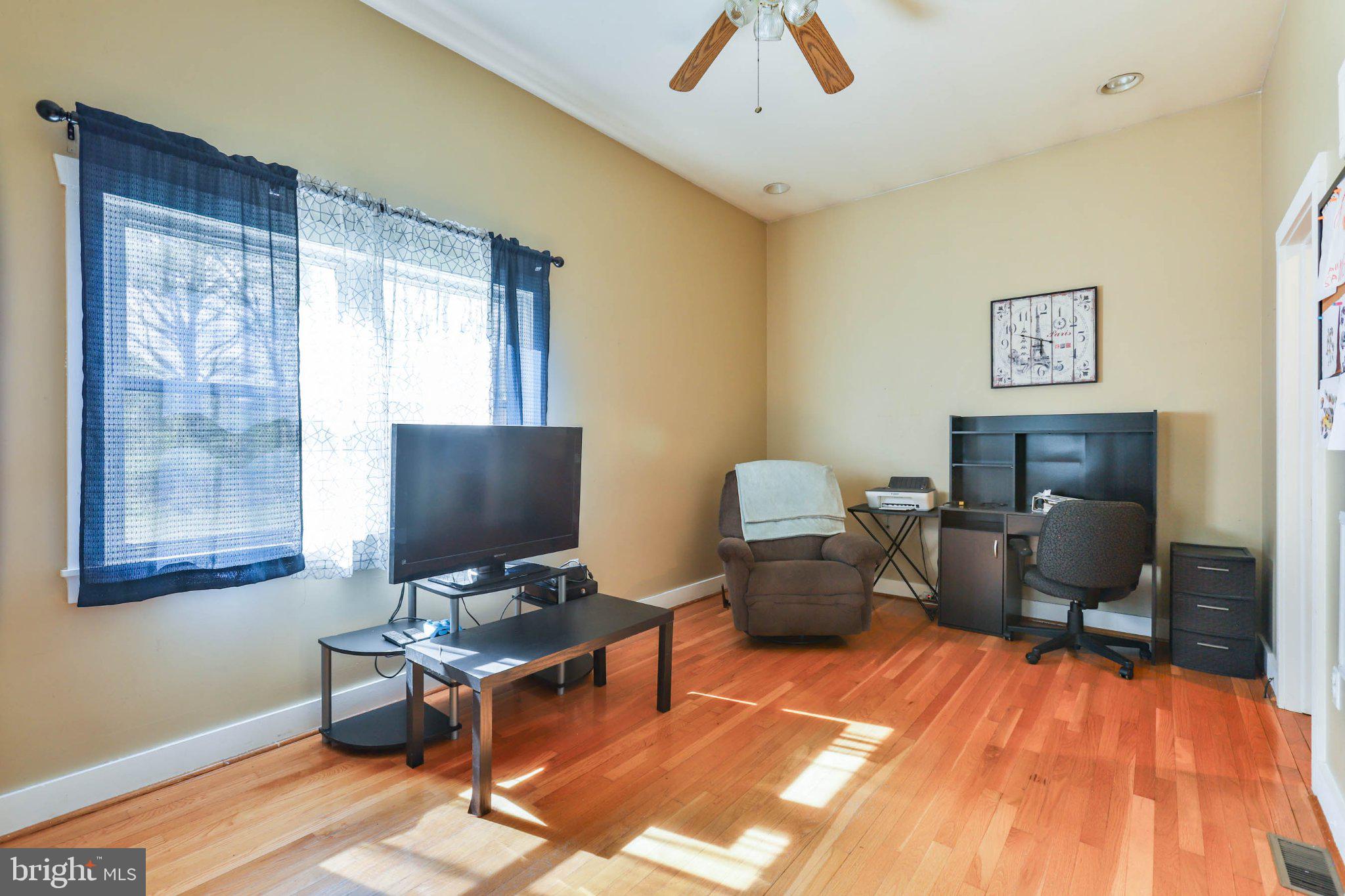 11661 Tanyard Hill Road Orrstown, PA 17244 - Photo 16 of 26 a view of a livingroom with workspace and a window