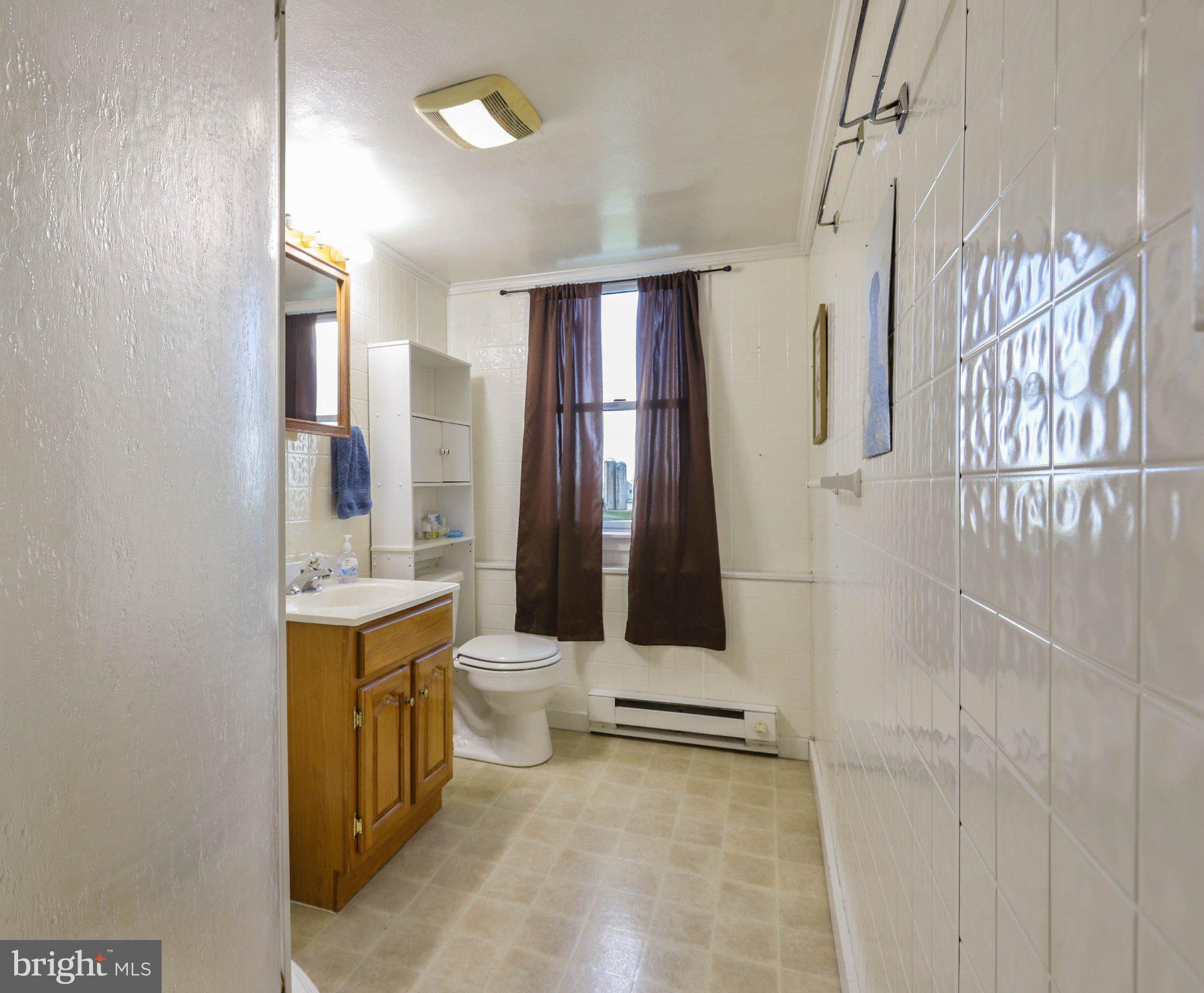 11661 Tanyard Hill Road Orrstown, PA 17244 - Photo 19 of 26 a bathroom with a toilet sink and shower