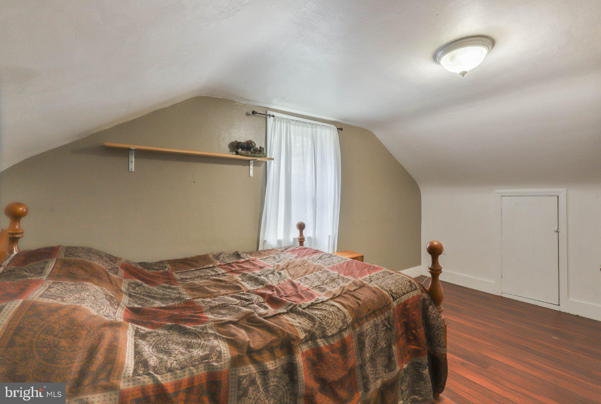 11661 Tanyard Hill Road Orrstown, PA 17244 - Photo 20 of 26 a bedroom with a bed and a window