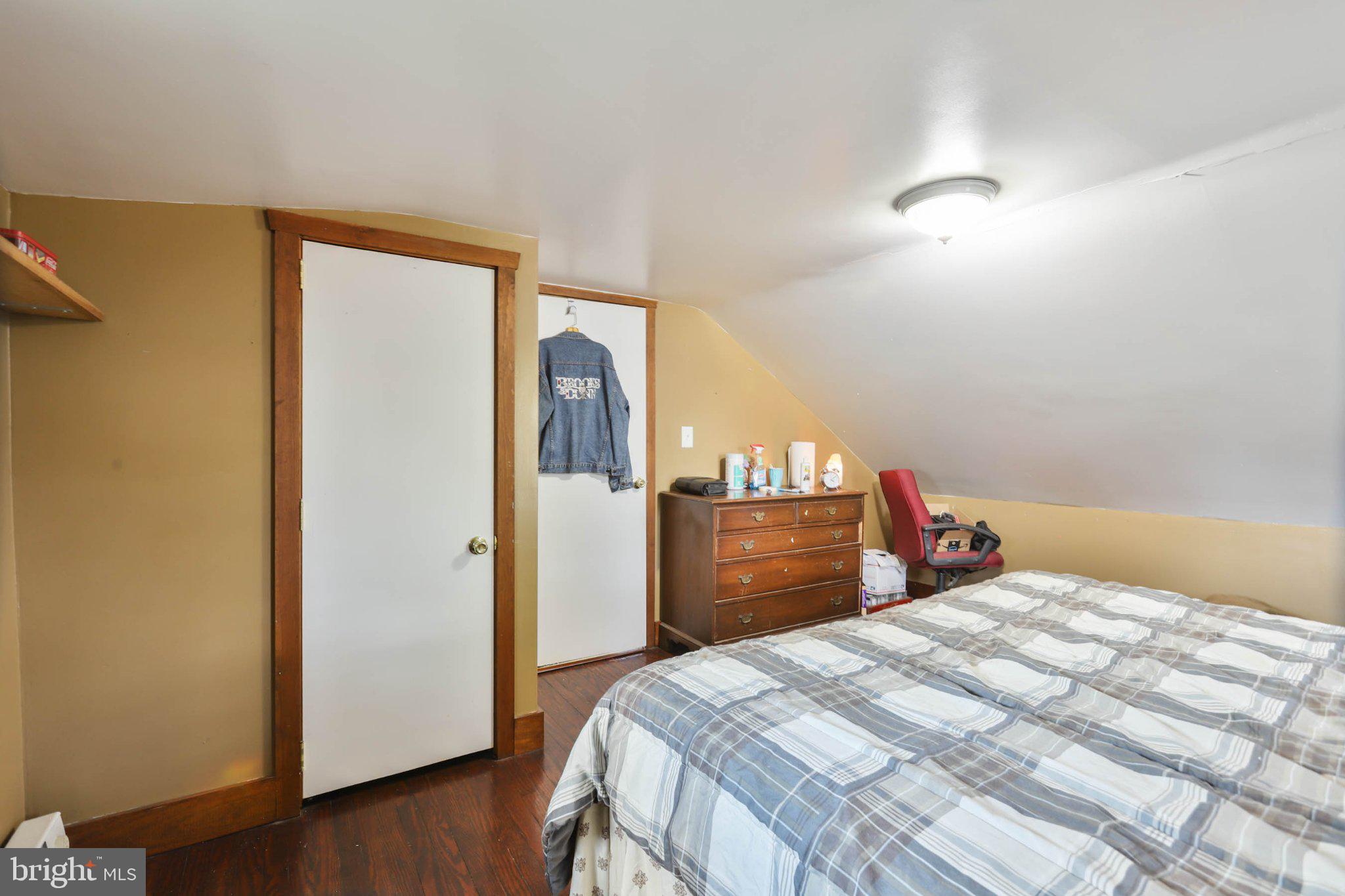 11661 Tanyard Hill Road Orrstown, PA 17244 - Photo 23 of 26 a bedroom with a bed and wooden floor