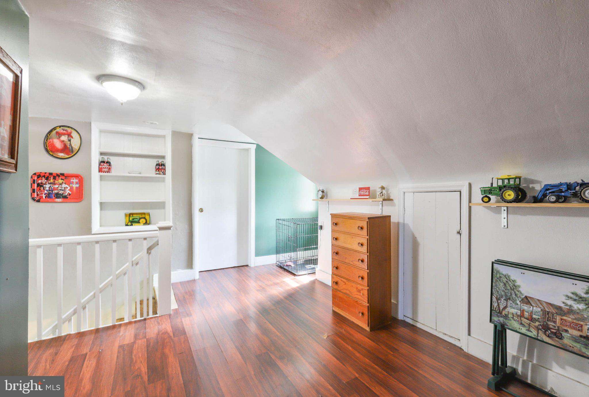 11661 Tanyard Hill Road Orrstown, PA 17244 - Photo 24 of 26 a view of a hallway with wooden floor and furniture