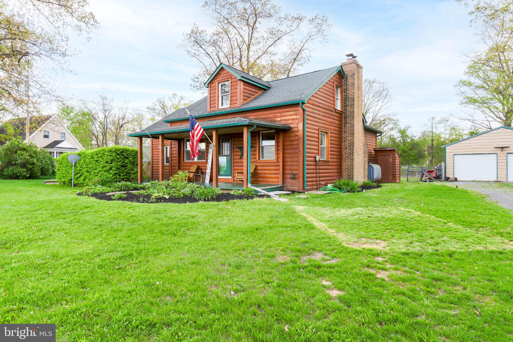 11661 Tanyard Hill Road Orrstown, PA 17244 - Photo 3 of 26 a front view of a house with garden