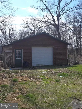 a house with a tree in front of it