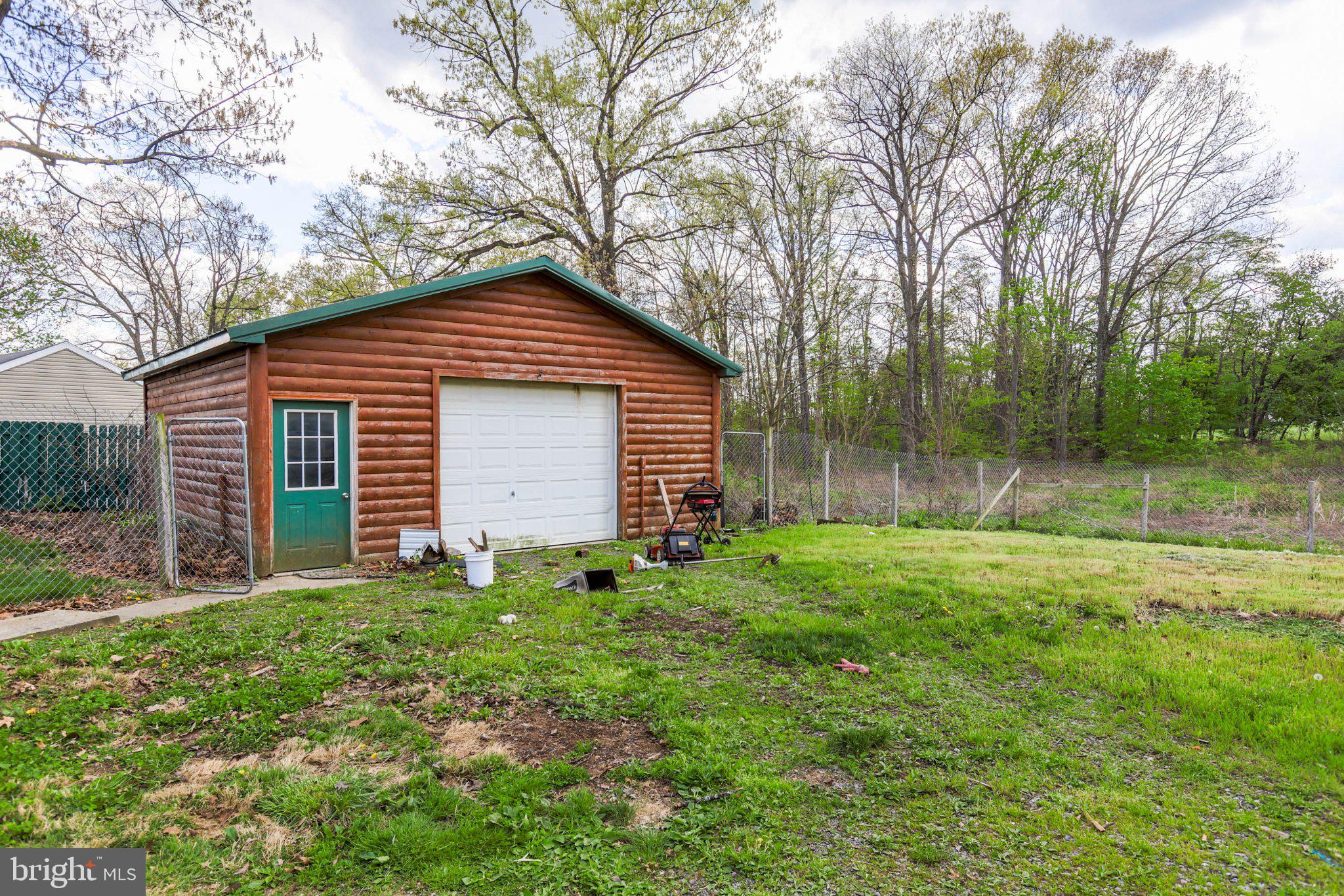 11661 Tanyard Hill Road Orrstown, PA 17244 - Photo 5 of 26 a front view of a house with garden