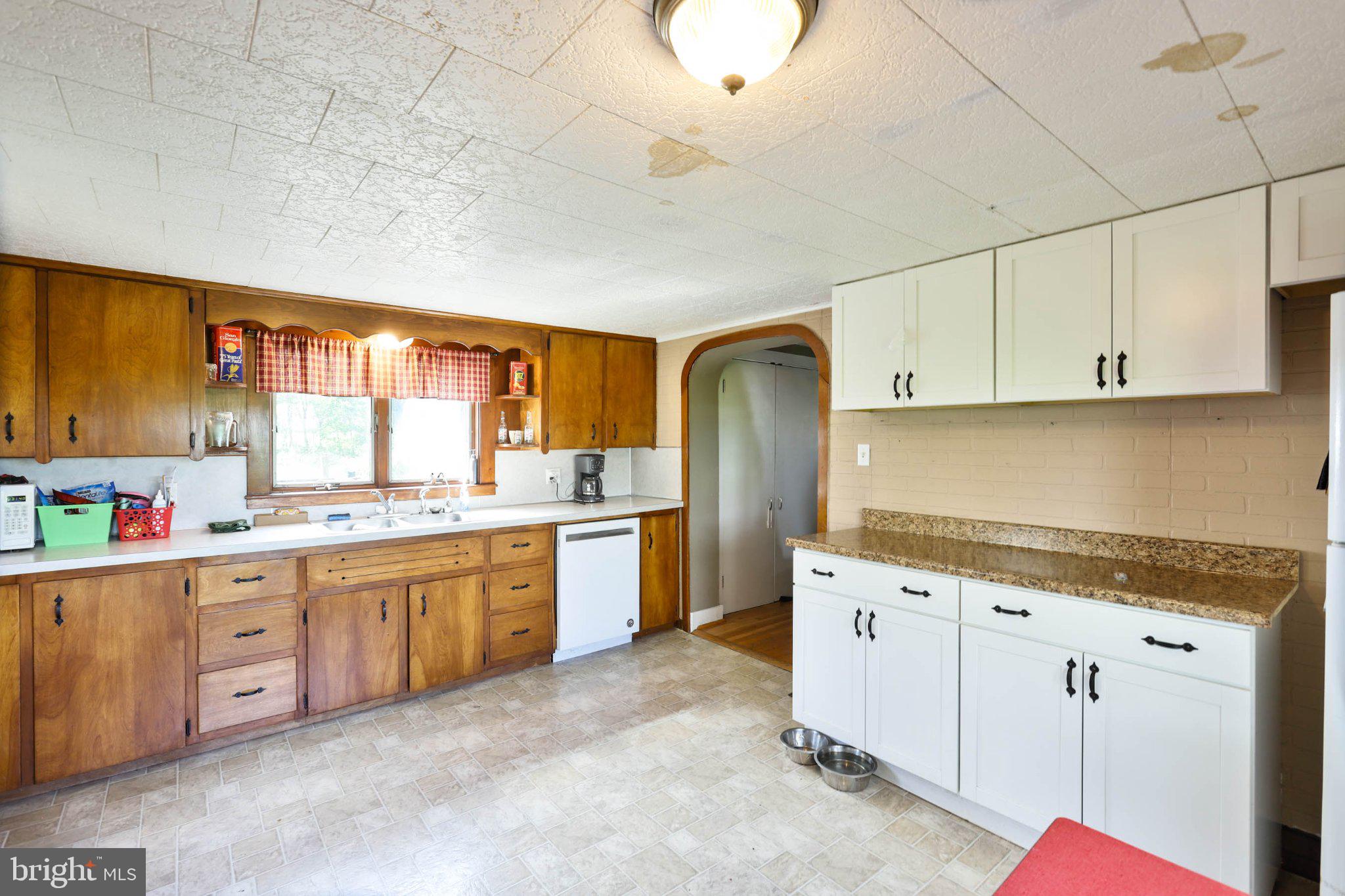11661 Tanyard Hill Road Orrstown, PA 17244 - Photo 10 of 26 a kitchen with granite countertop a sink and cabinets