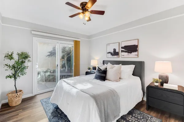 a bedroom with bed and a window