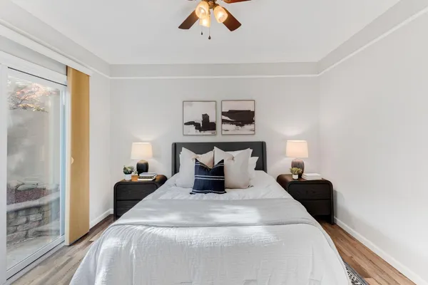 a bedroom with a bed and window
