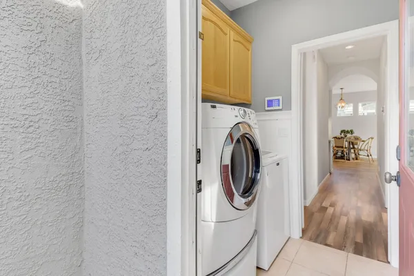 a view of a hallway with washer and dryer