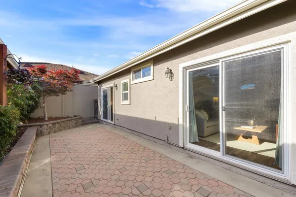 a view of a house with a backyard