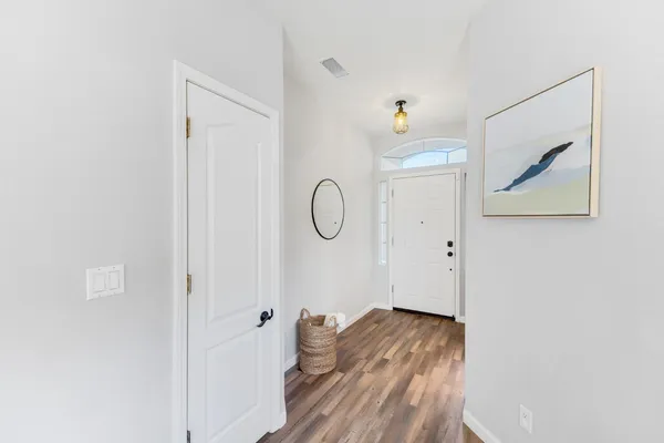 a view of room with wooden floor