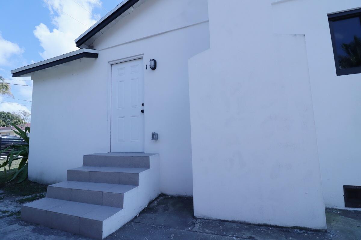 3040 Northwest 13th Avenue Miami, FL 33142 - Photo 13 of 16 a view of entryway and hall with wooden floor
