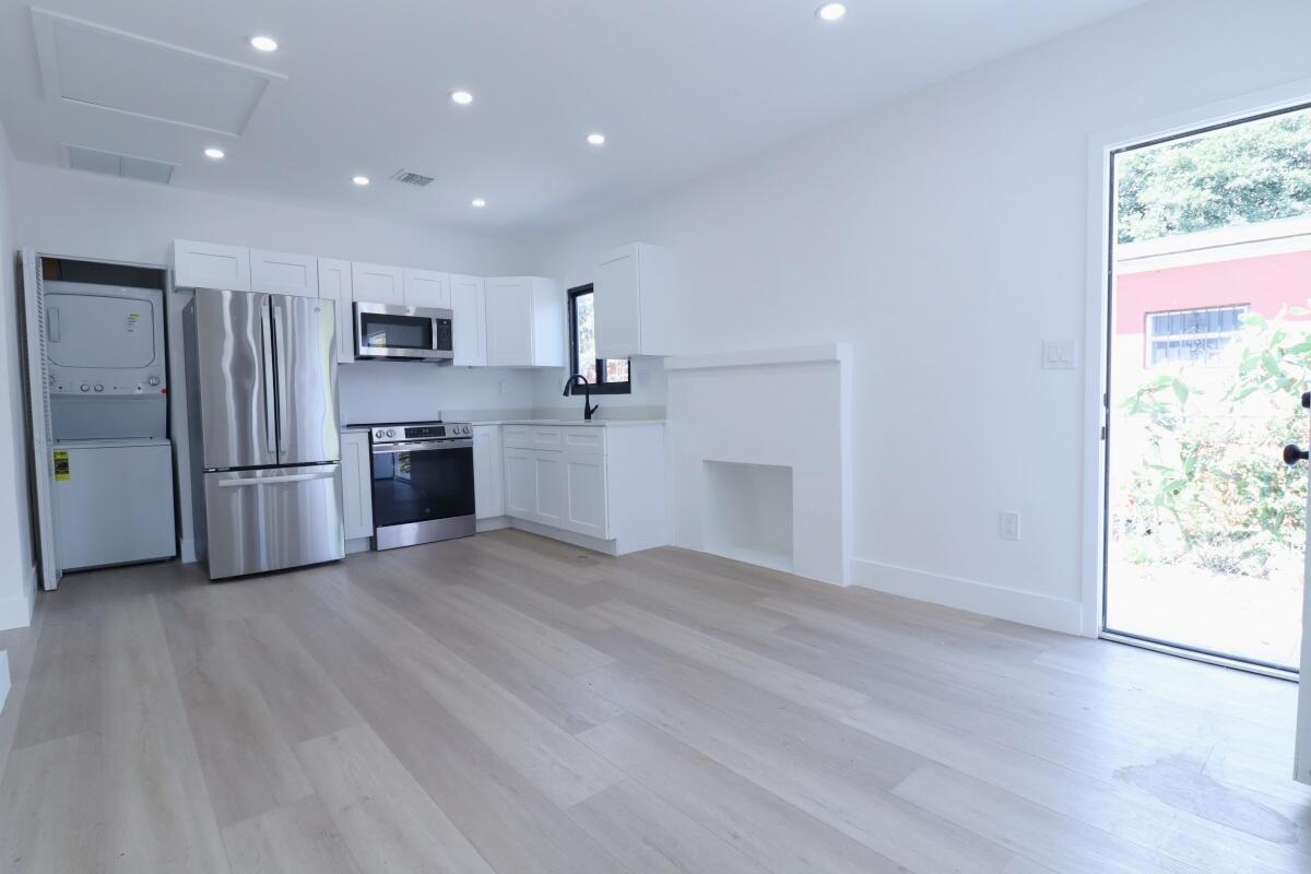 3040 Northwest 13th Avenue Miami, FL 33142 - Photo 5 of 16 a view of a kitchen with a sink and a refrigerator