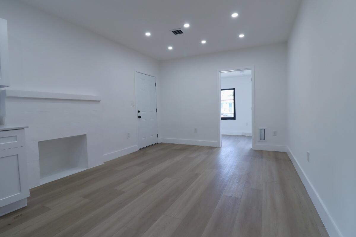 3040 Northwest 13th Avenue Miami, FL 33142 - Photo 7 of 16 an empty room with wooden floor and closet