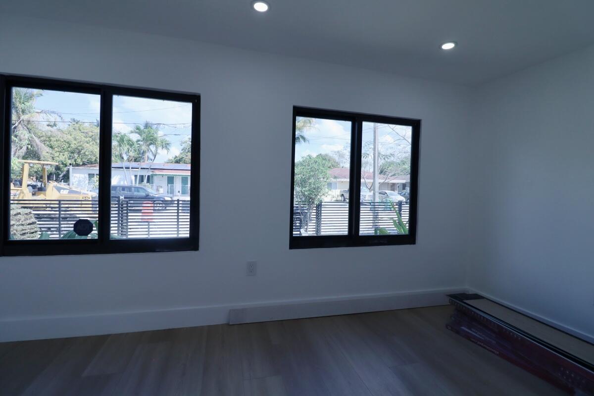 3040 Northwest 13th Avenue Miami, FL 33142 - Photo 8 of 16 a view of an empty room with a window
