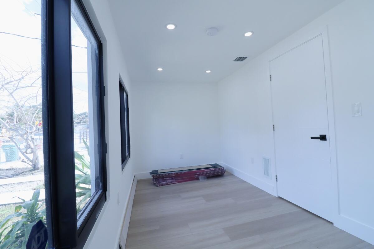 3040 Northwest 13th Avenue Miami, FL 33142 - Photo 9 of 16 an empty room with windows