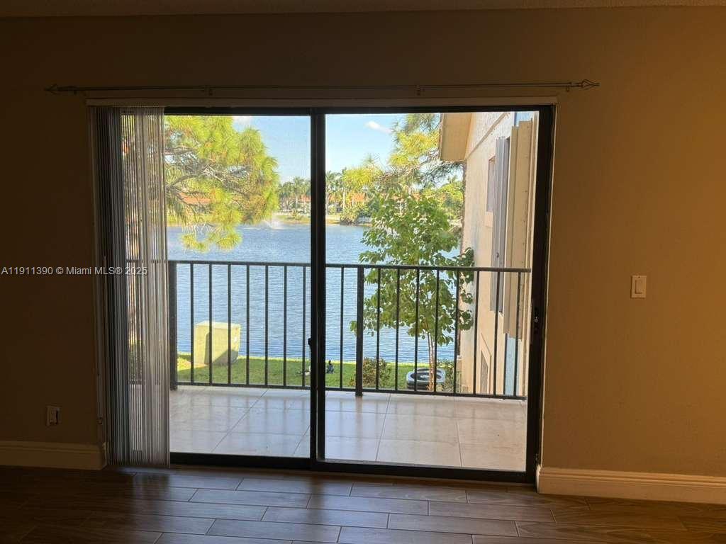 1580 Windorah Way, Unit E West Palm Beach, FL 33411 - Photo 1 of 20 a view of a porch with wooden floor