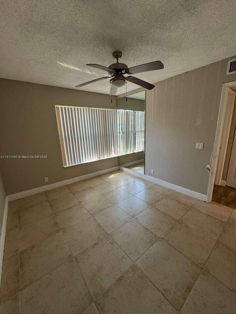 1580 Windorah Way, Unit E West Palm Beach, FL 33411 - Photo 18 of 20 a view of a livingroom with a staircase