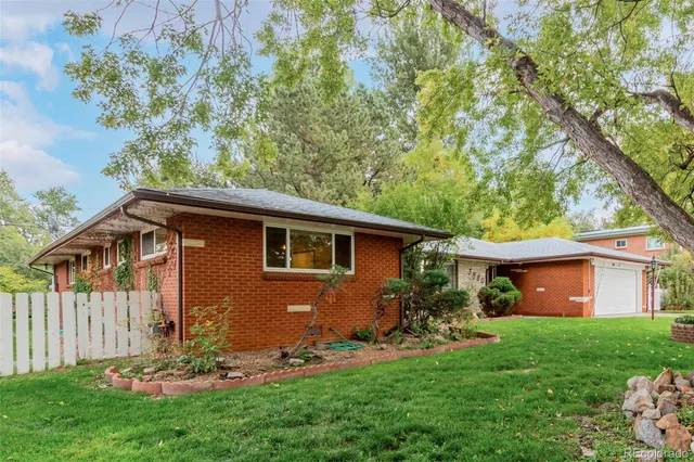 a front view of a house with a yard and porch