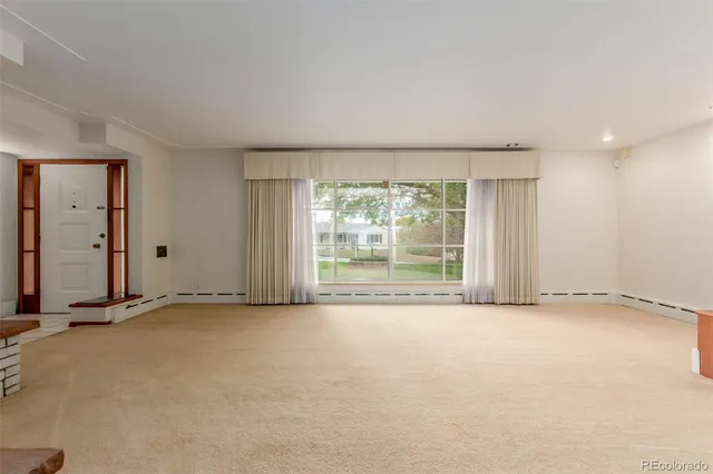 an empty room with a fireplace