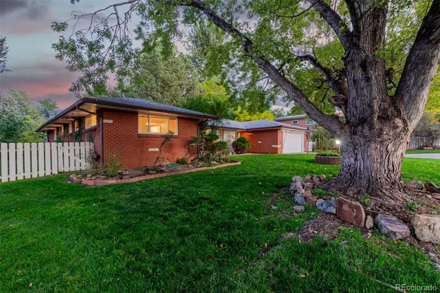 a backyard of a house with lots of green space