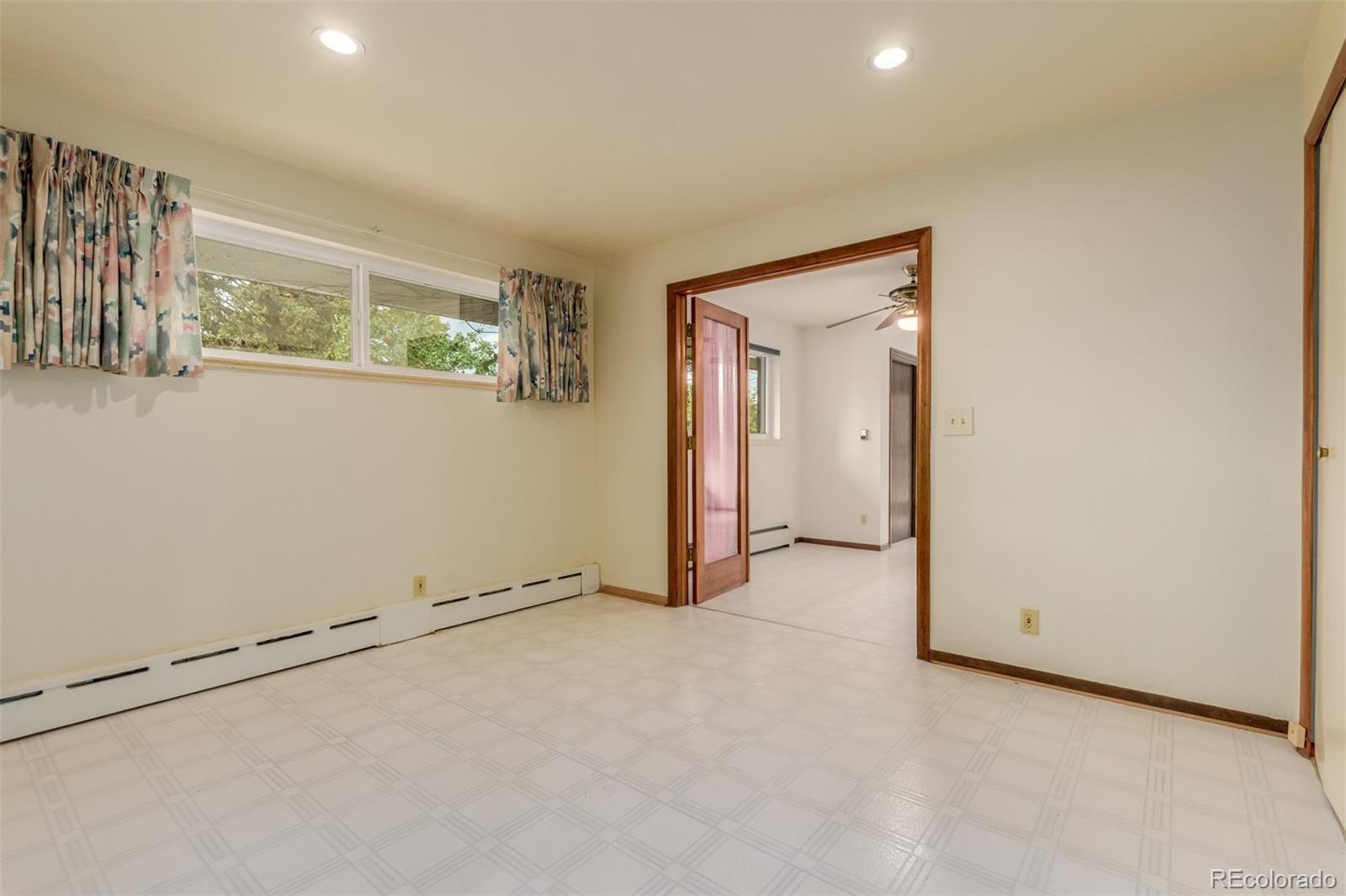 3880 Independence Court Wheat Ridge, CO 80033 - Photo 31 of 47 an empty room with windows