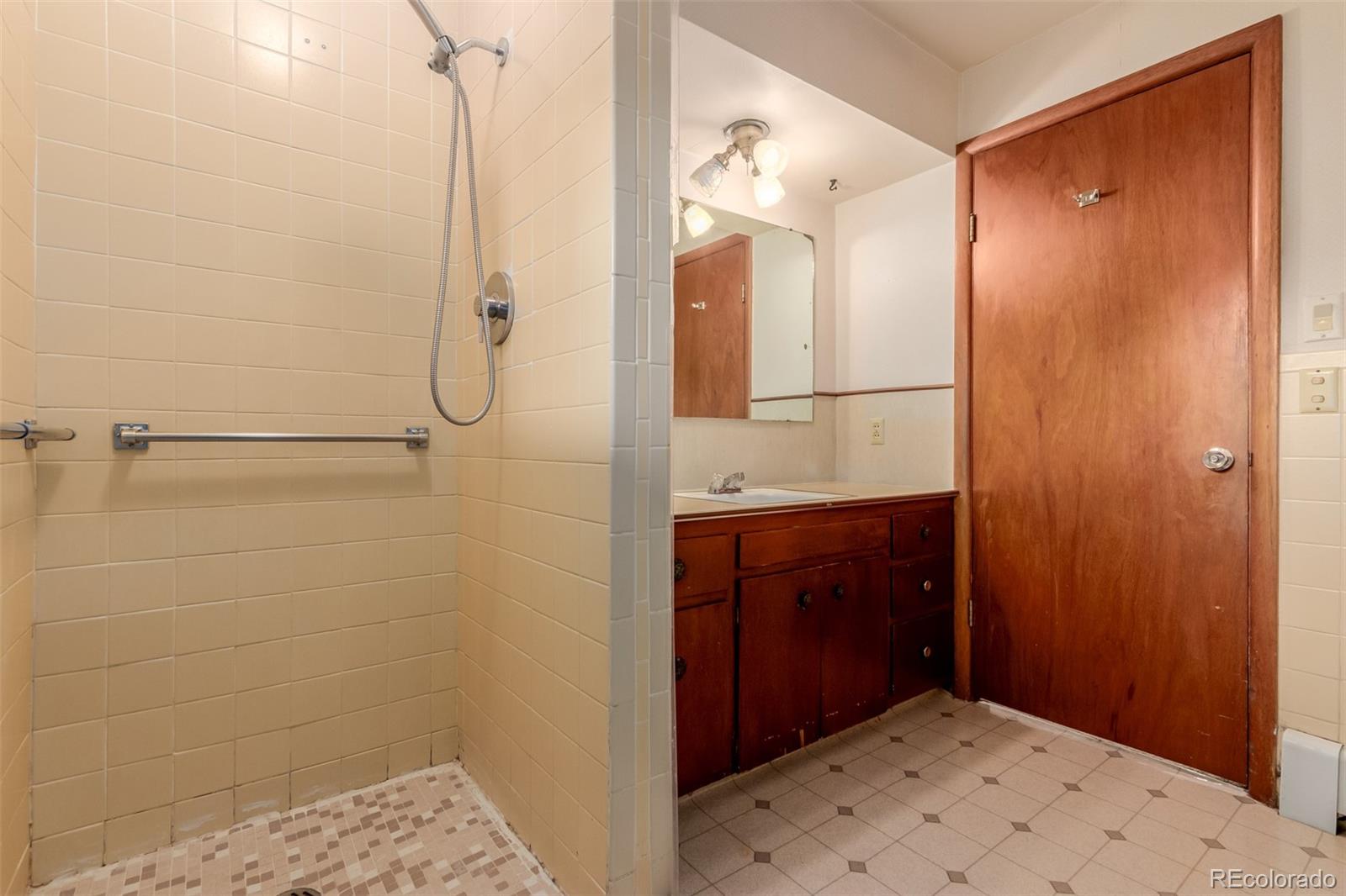 3880 Independence Court Wheat Ridge, CO 80033 - Photo 33 of 47 a bathroom with a shower and a sink