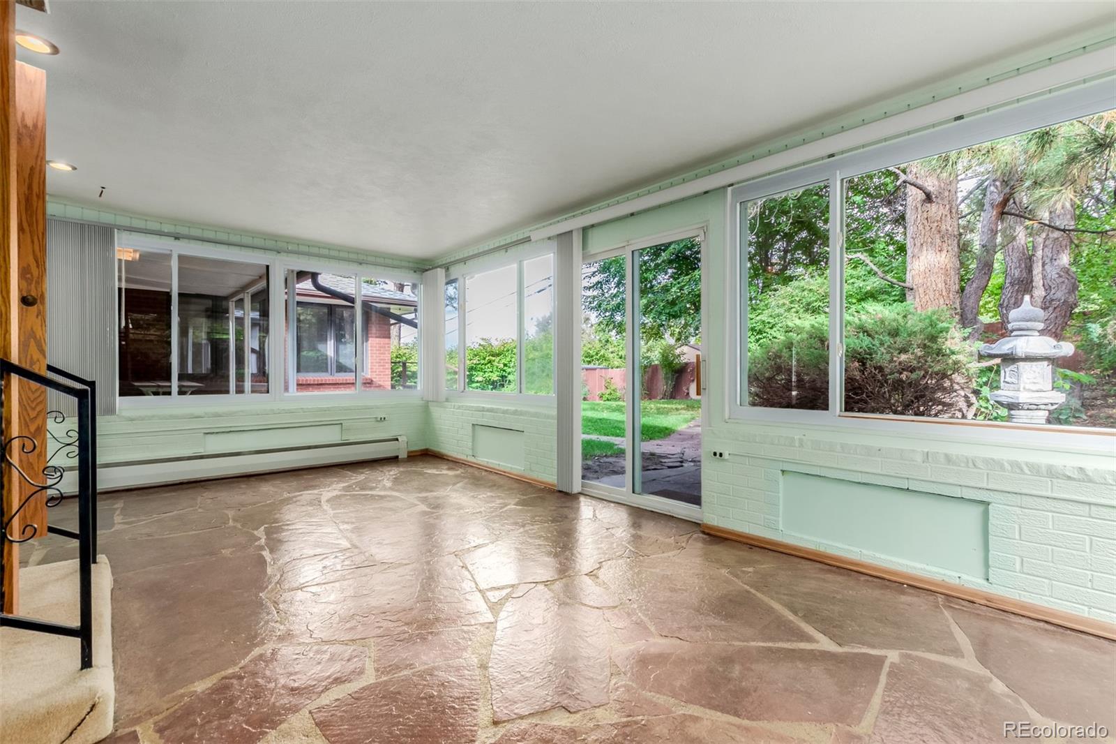 3880 Independence Court Wheat Ridge, CO 80033 - Photo 34 of 47 a view of a garden with an outdoor seating