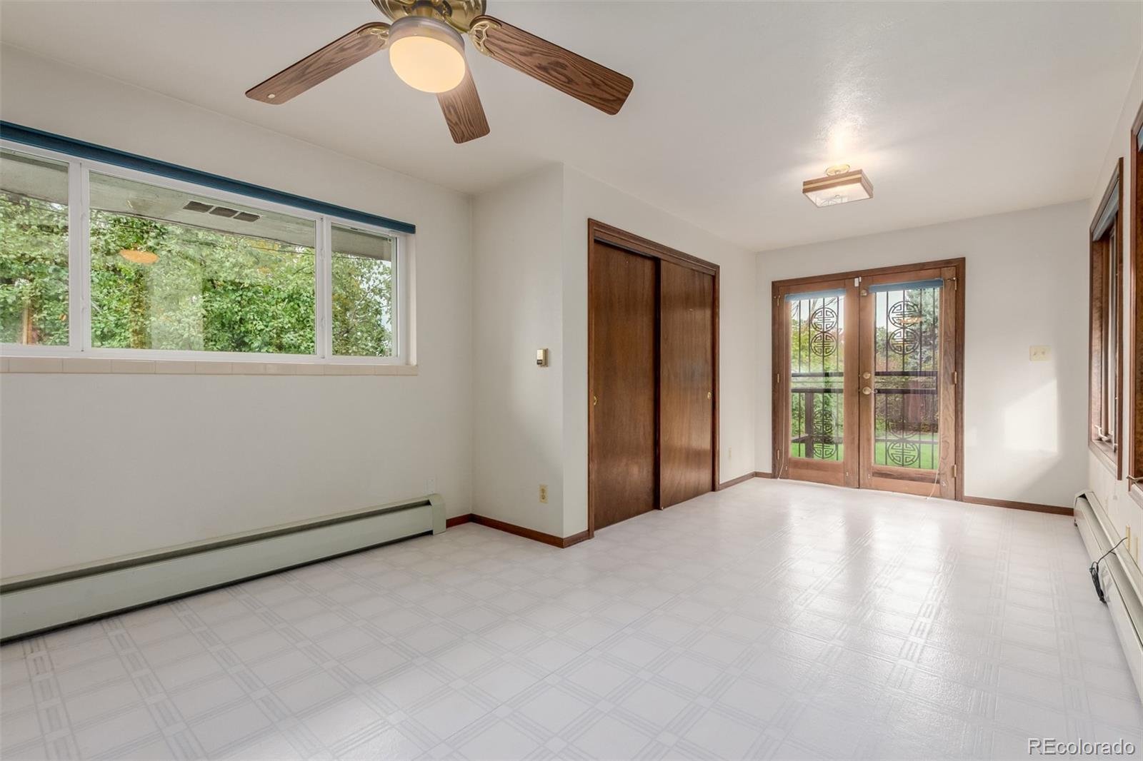 3880 Independence Court Wheat Ridge, CO 80033 - Photo 36 of 47 a view of a livingroom with an empty space and a window