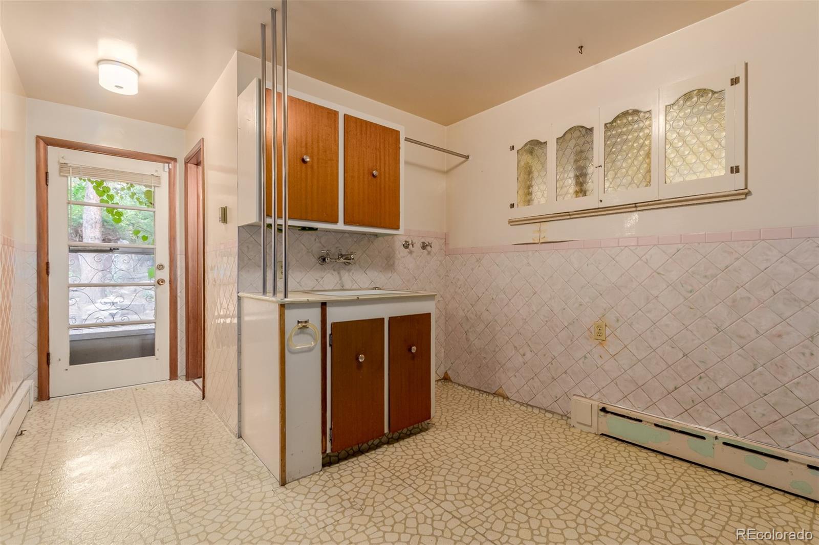 3880 Independence Court Wheat Ridge, CO 80033 - Photo 39 of 47 a bathroom with a sink and a mirror