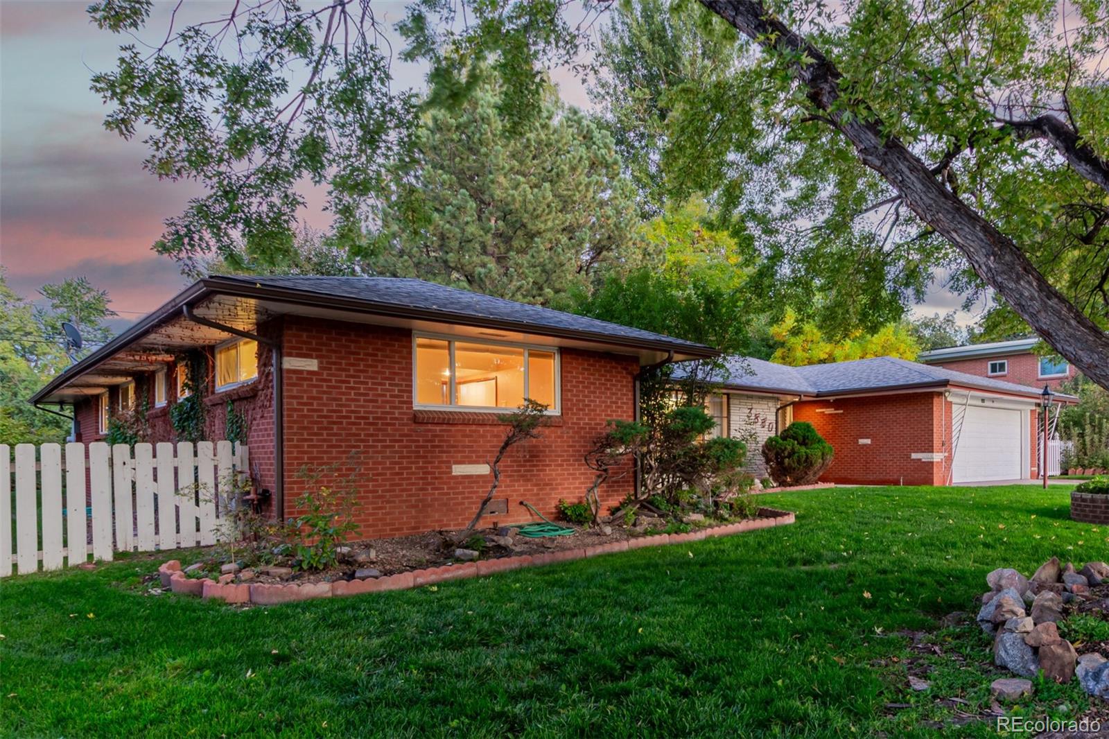 3880 Independence Court Wheat Ridge, CO 80033 - Photo 4 of 47 a front view of a house with garden