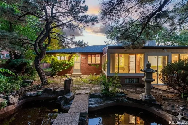 a living room filled with furniture and a large window