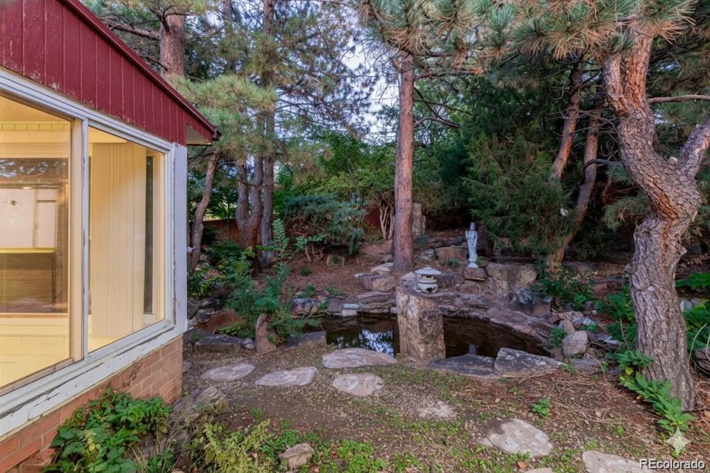 3880 Independence Court Wheat Ridge, CO 80033 - Photo 43 of 47 a view of backyard with plants and outdoor seating